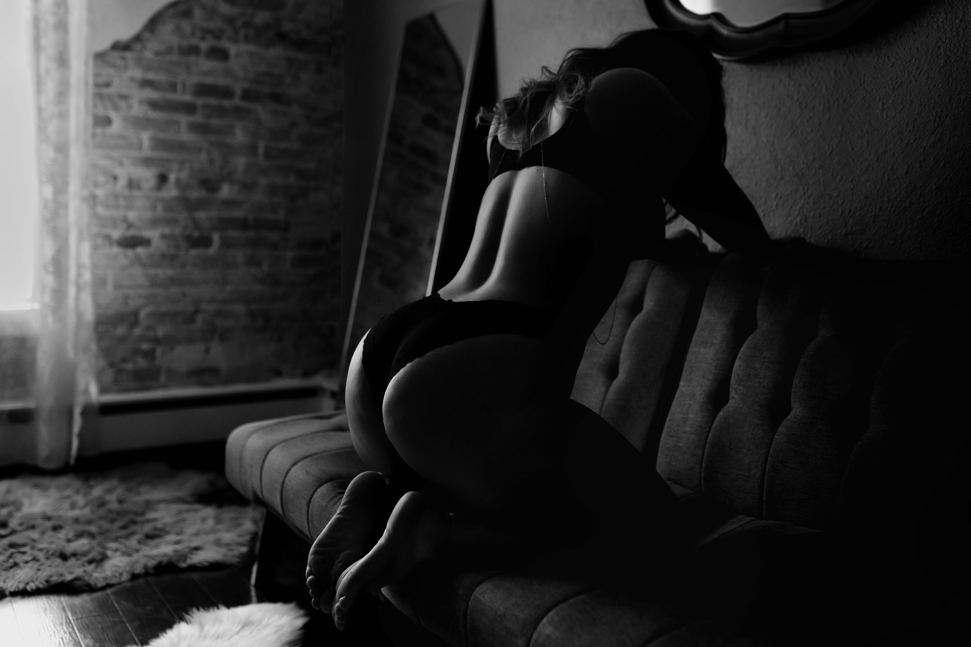 Denver boudoir client posing for photo