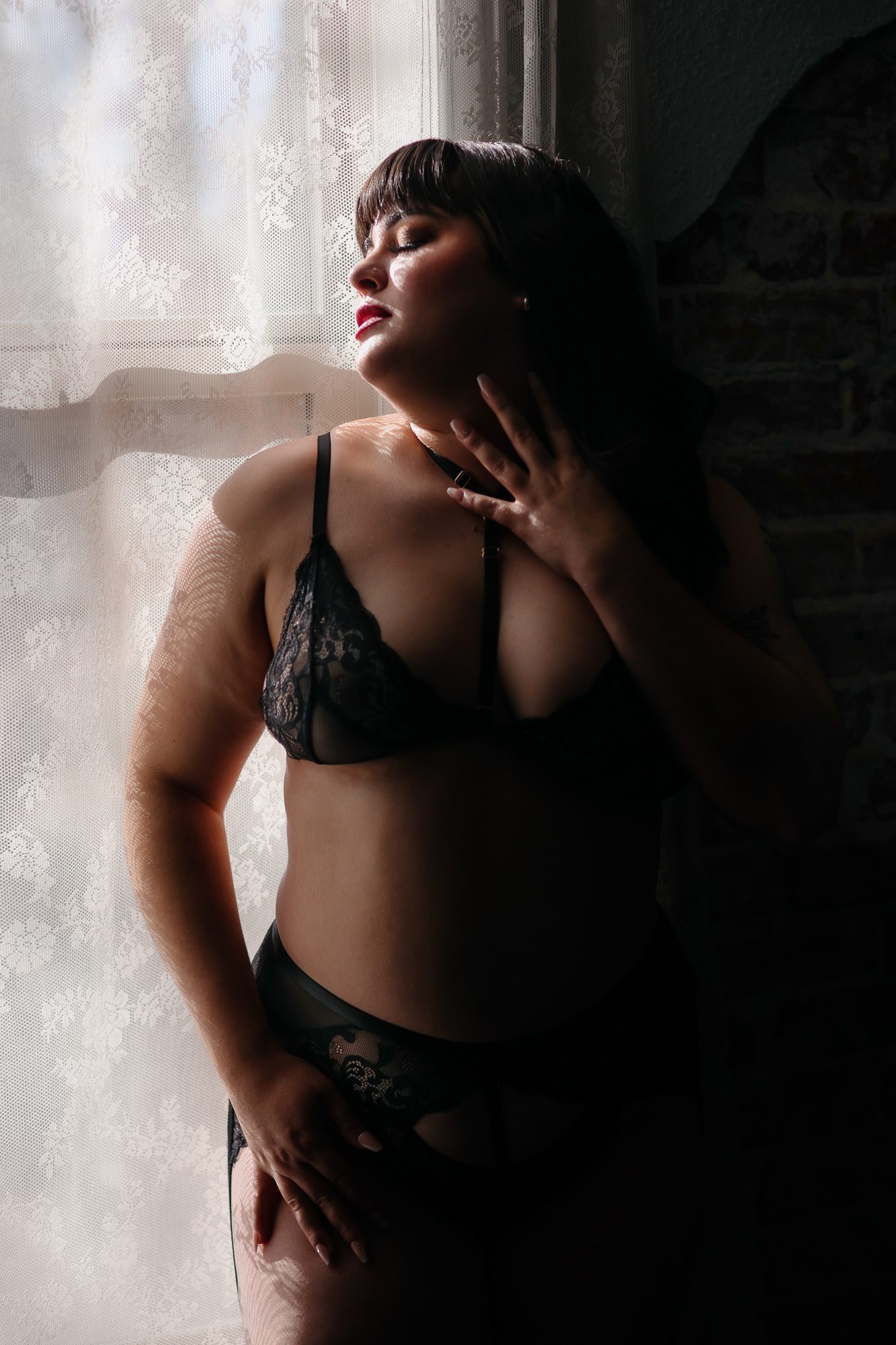 Boudoir Denver client posing for photo