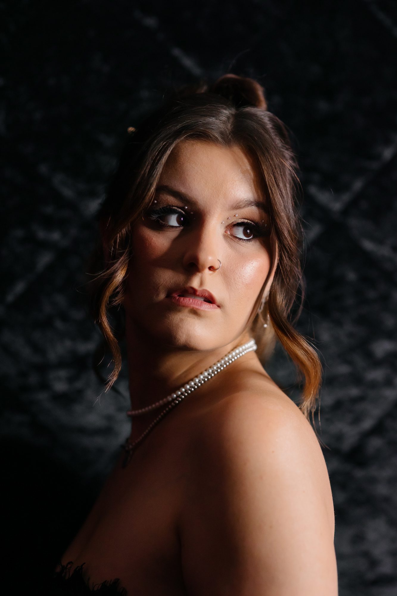 Denver boudoir client posing for birthday photo shoot