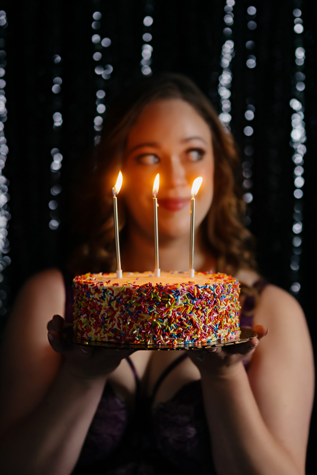 Denver boudoir client posing for birthday photo shoot