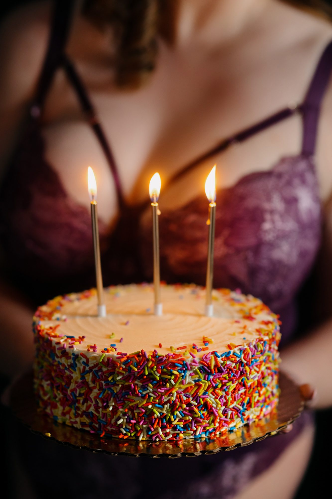 Denver boudoir client posing for birthday photo shoot