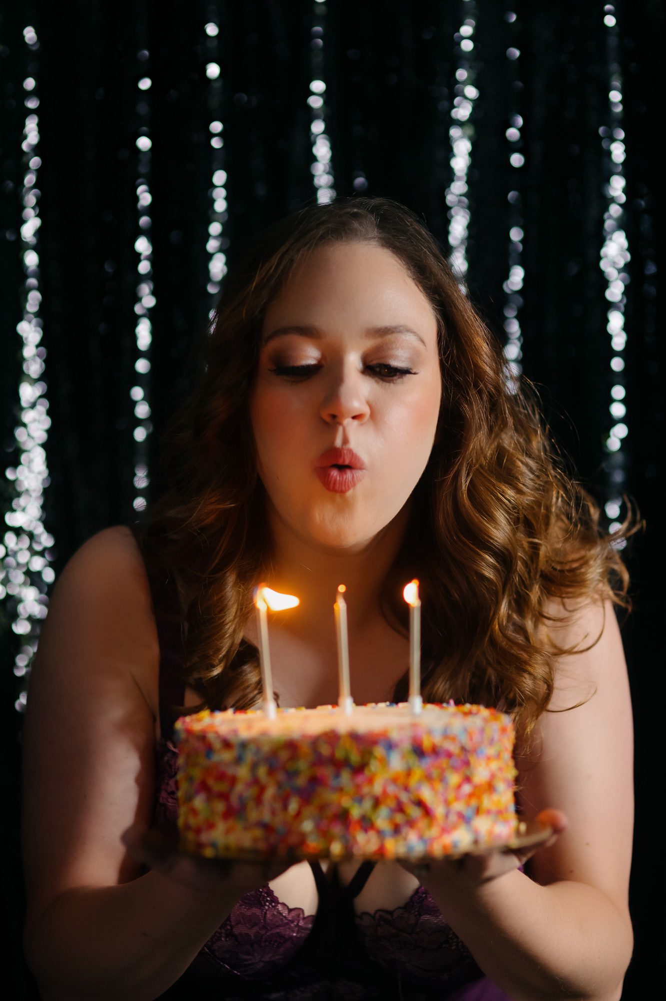 Denver boudoir client posing for birthday photo shoot