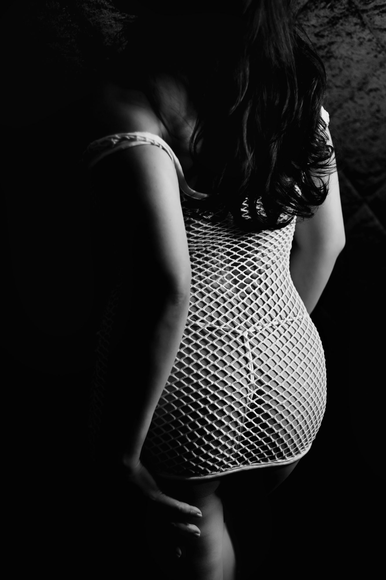 Photo of Denver boudoir client posing for boudoir shoot