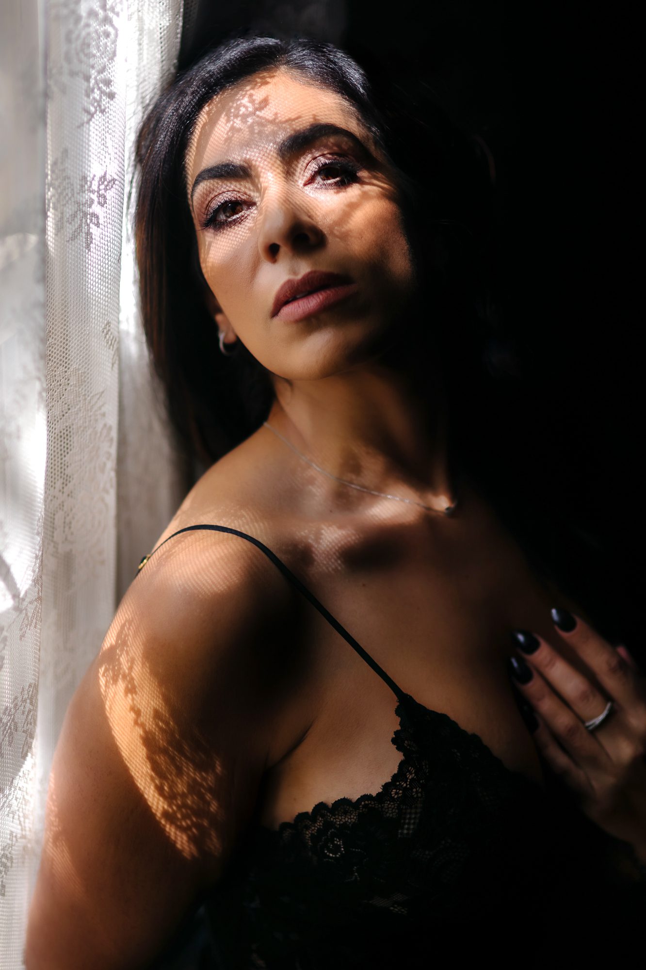 Photo of Denver boudoir client posing for boudoir shoot